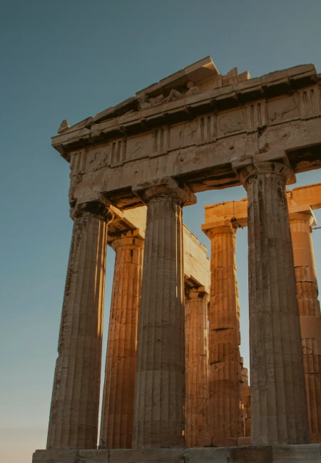 The Parthenon temple in Athens, Greece, a masterpiece of ancient Greek architecture at sunset.